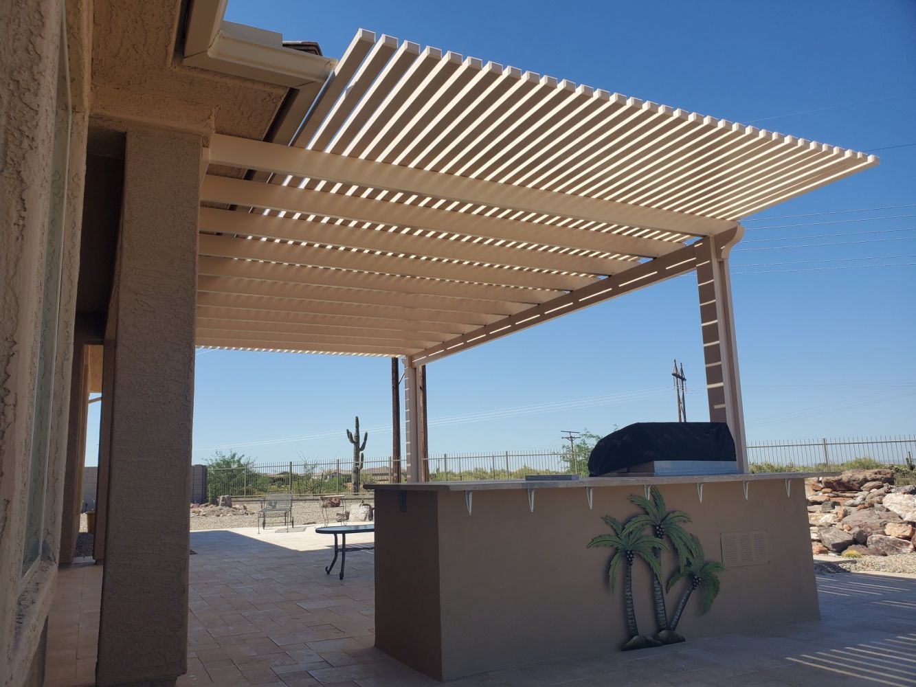 New River homestead enhanced with a Southwest Patio lattice patio cover, perfect for scenic mountain views.