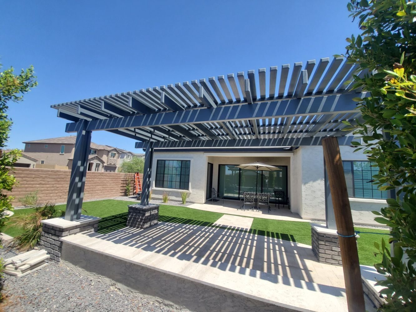 Cave Creek retreat equipped with an elegant lattice patio cover, offering an ideal setting for desert star-gazing.