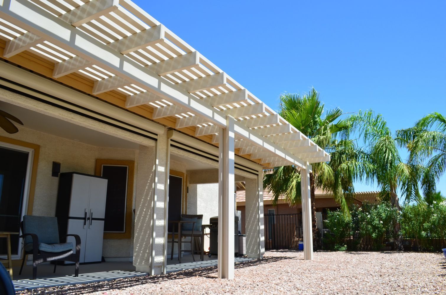 Youngtown residence upgraded with a Southwest Patio lattice patio cover, blending seamlessly with quaint charm.