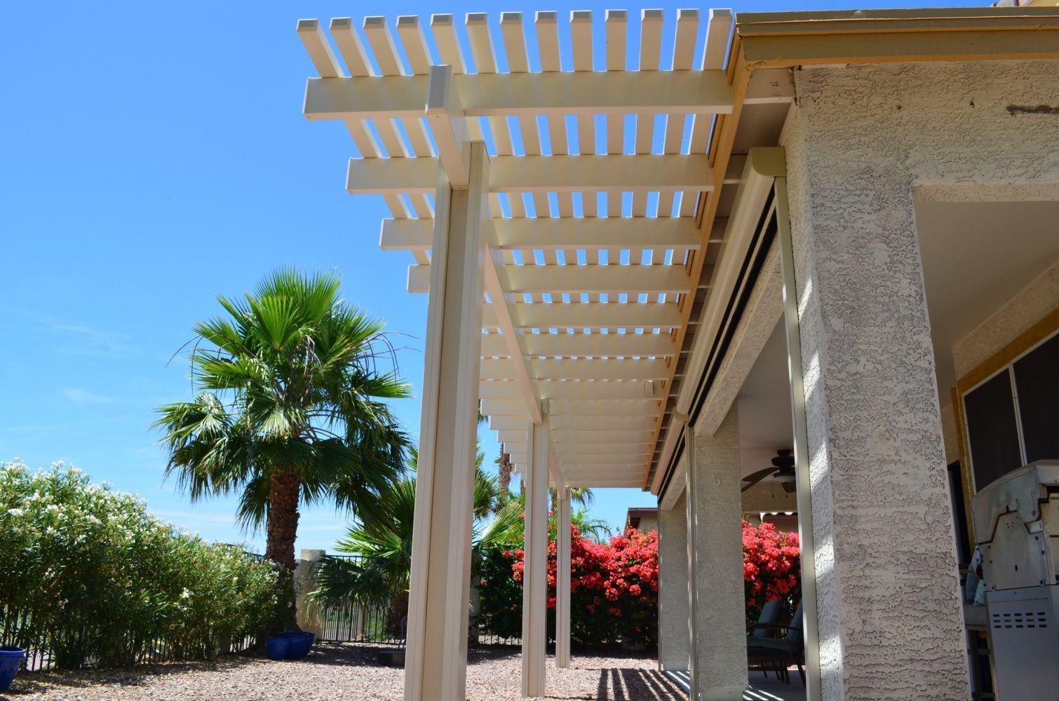 Carefree home adorned with a Southwest Patio open lattice cover, enhancing the artistic vibe of the outdoor space.