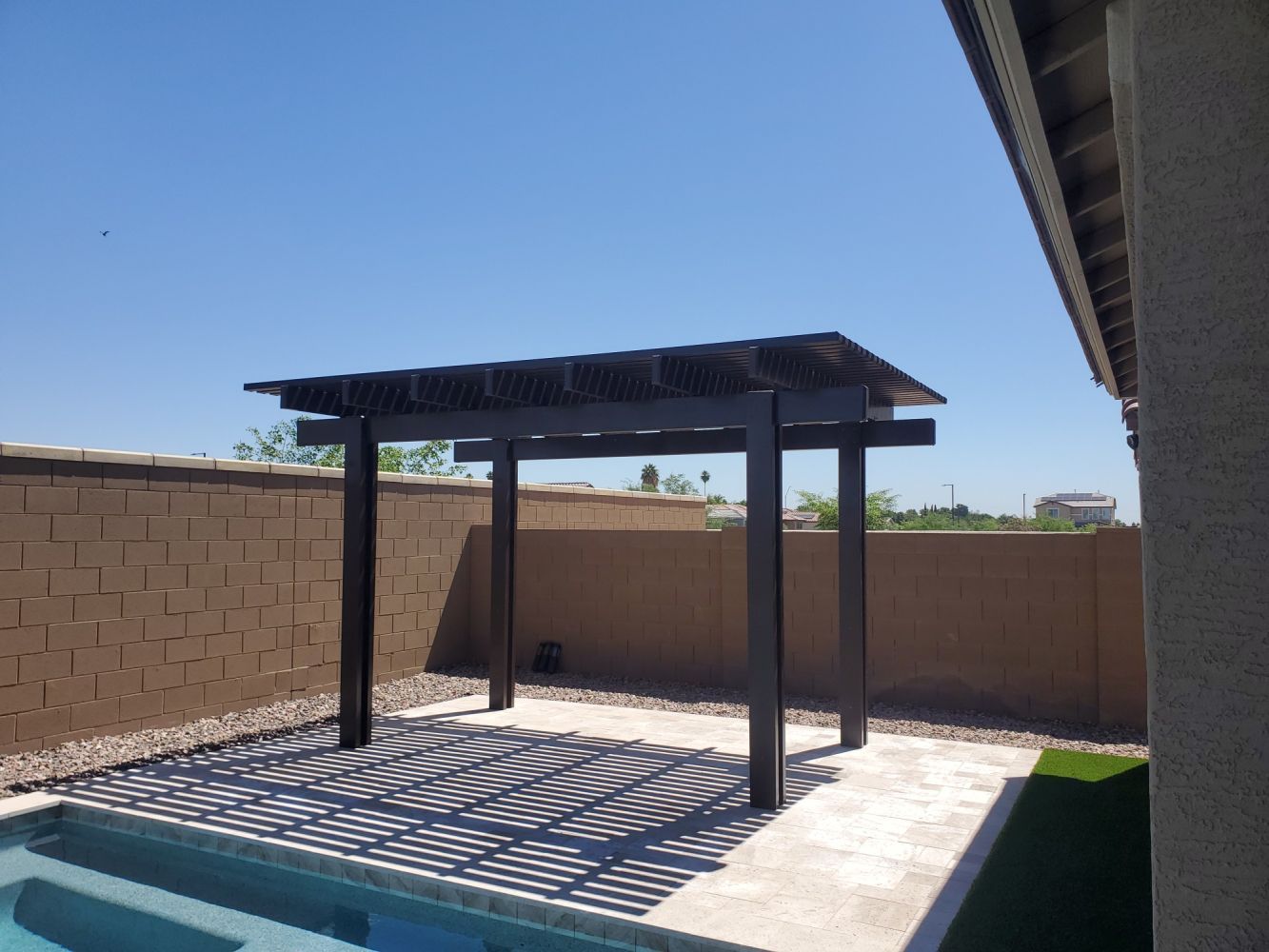 Fountain Hills backyard transformed with a chic lattice patio cover, merging luxury with Arizona's natural beauty.
