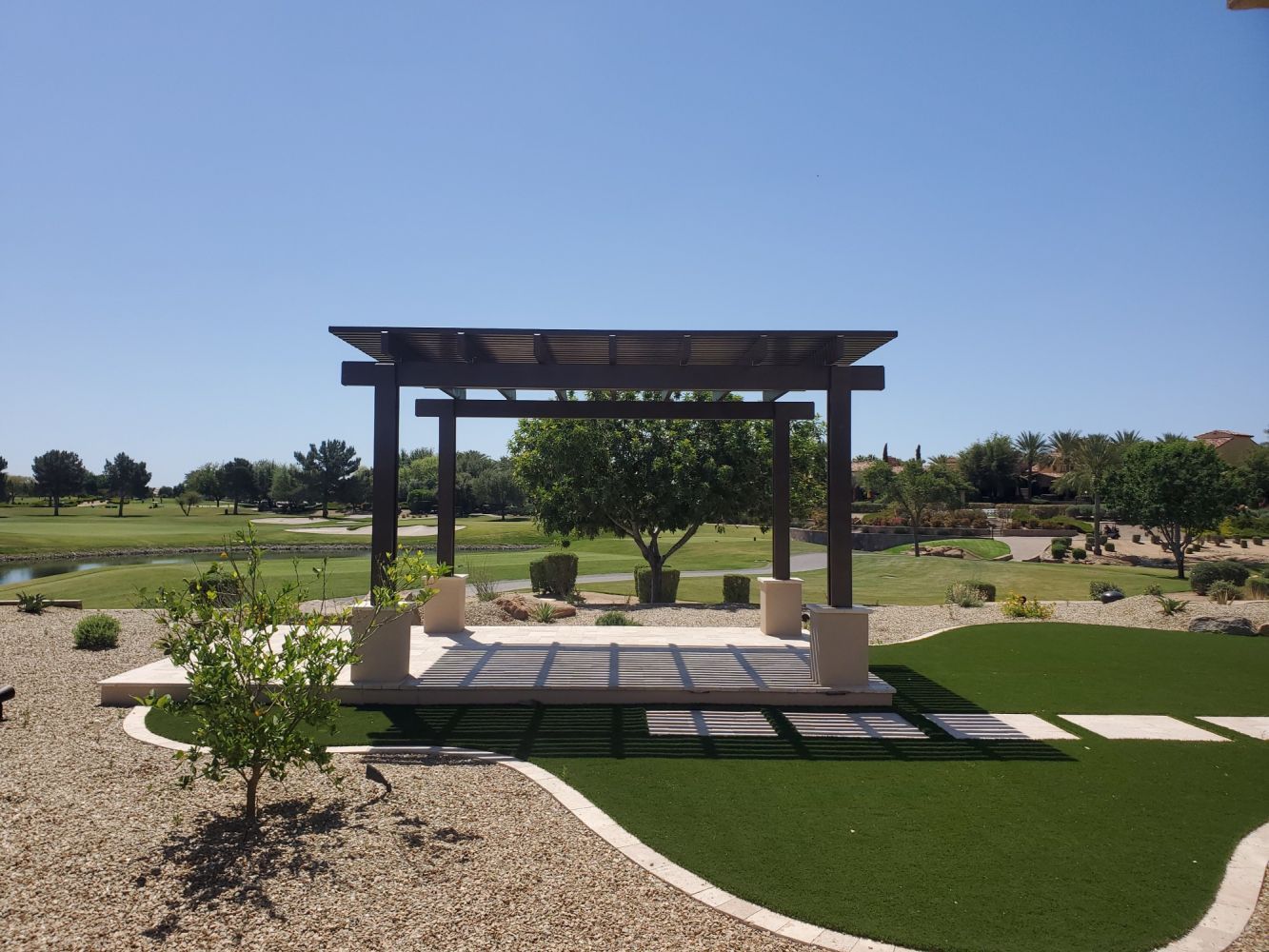 Lattice patio cover casting elegant shadows in Buckeye, enhancing outdoor gatherings with Southwest Patio's design.