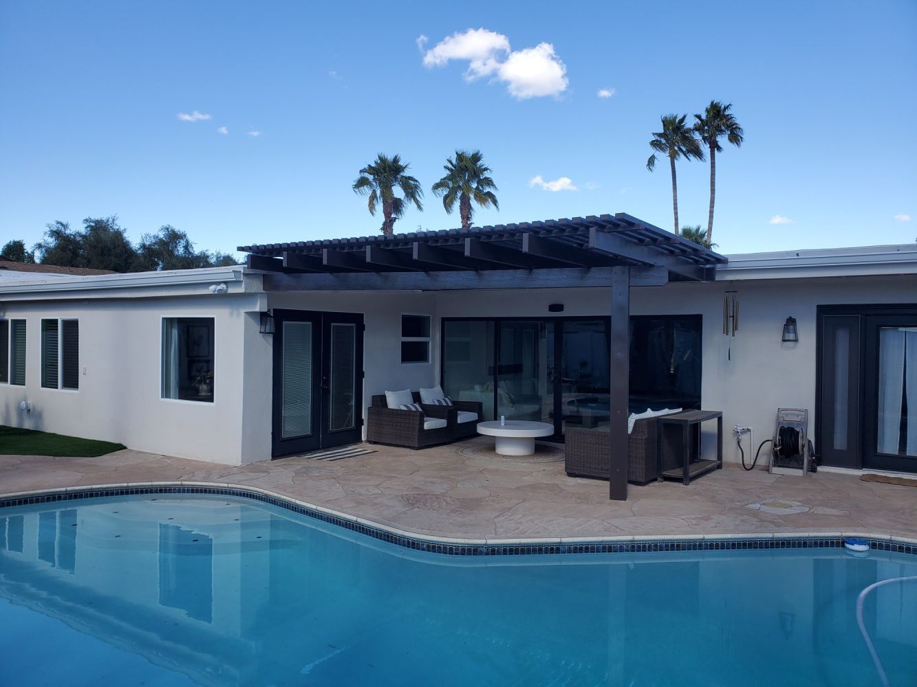 Tolleson home featuring a Southwest Patio lattice cover, perfect for enjoying the desert climate in style.
