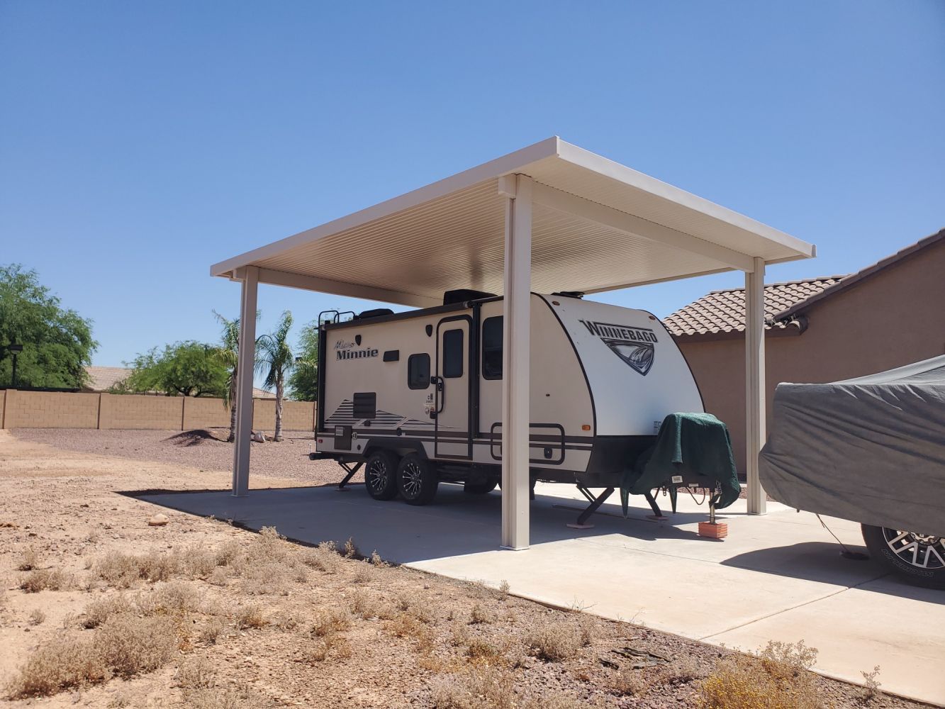 Families enjoying a shaded patio in Glendale, AZ, thanks to a durable Southwest Patio cover.