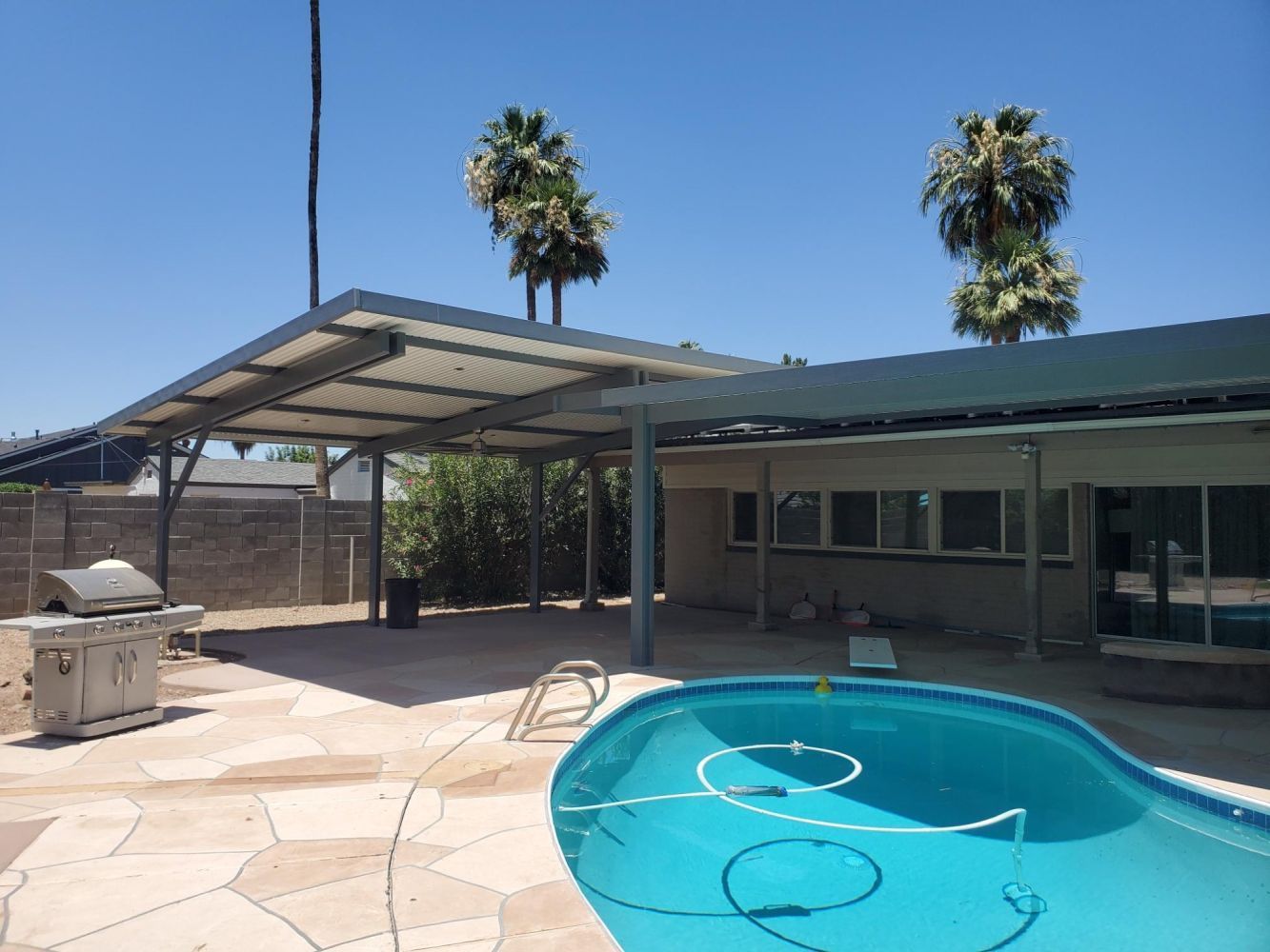 Rio Verde's serene villas shaded by Southwest Patio's Flat Pan Covers, marrying style with functionality.