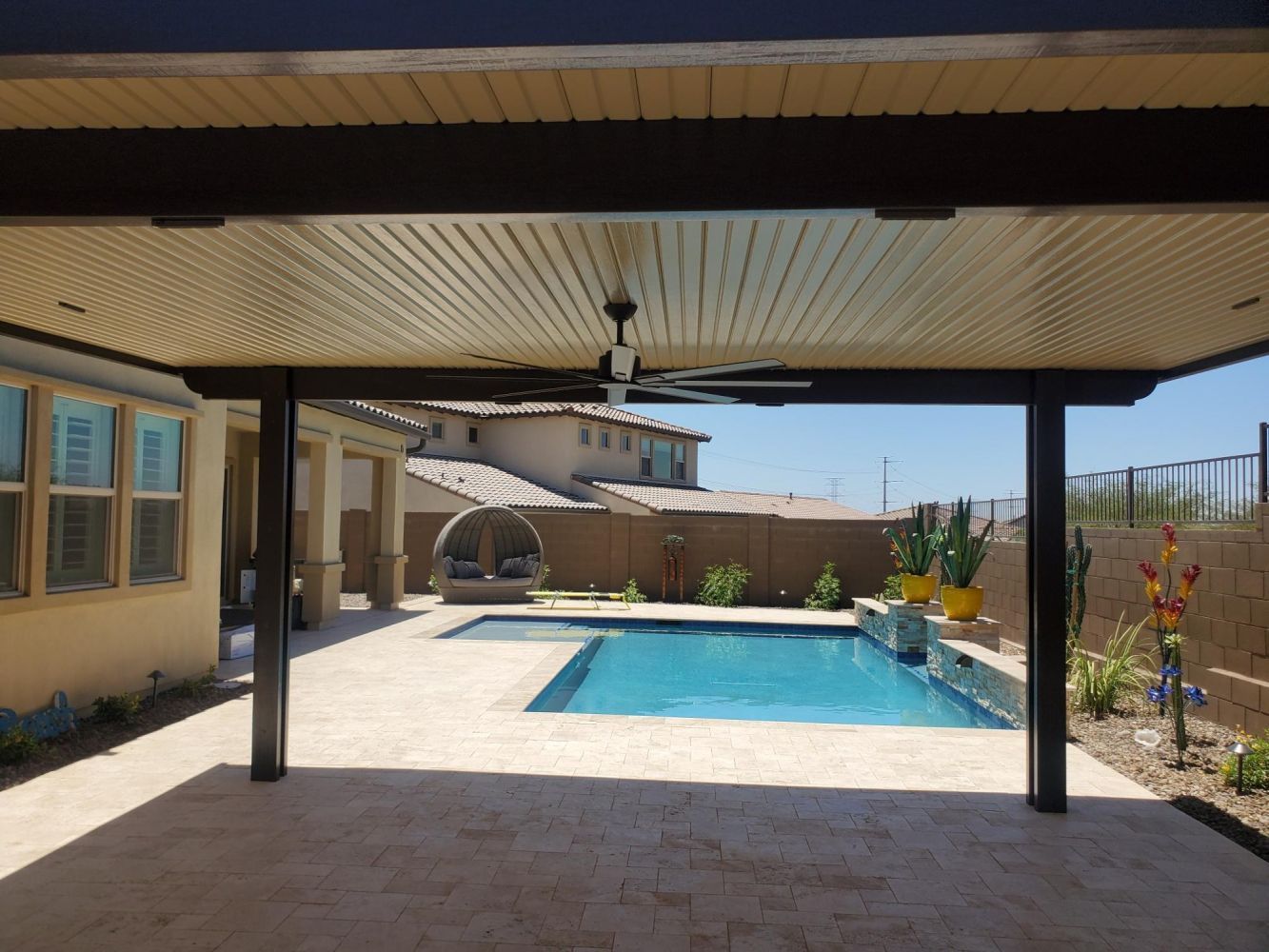 Youngtown homes updated with Solid Style Flat Pan Covers, offering a modern twist to patio design.