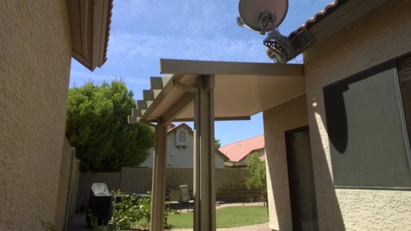 San Tan Valley's family gatherings shaded by durable Flat Pan Patio Covers, making every moment outdoors special.