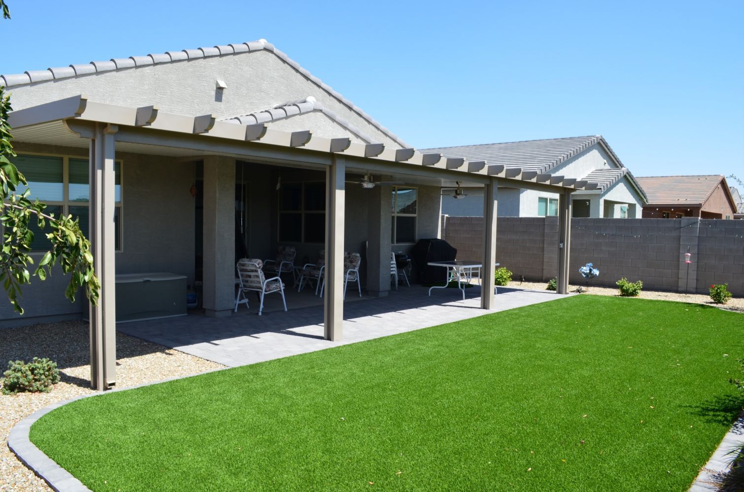 Sun City West golf courses equipped with Flat Pan Patio Covers, providing shade for outdoor enthusiasts.