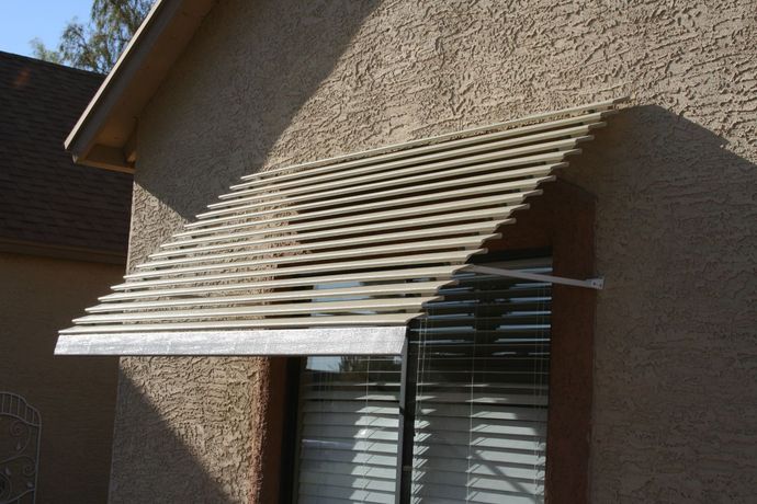 Window awnings from Southwest Patio, transforming and cooling Peoria, AZ home interiors.