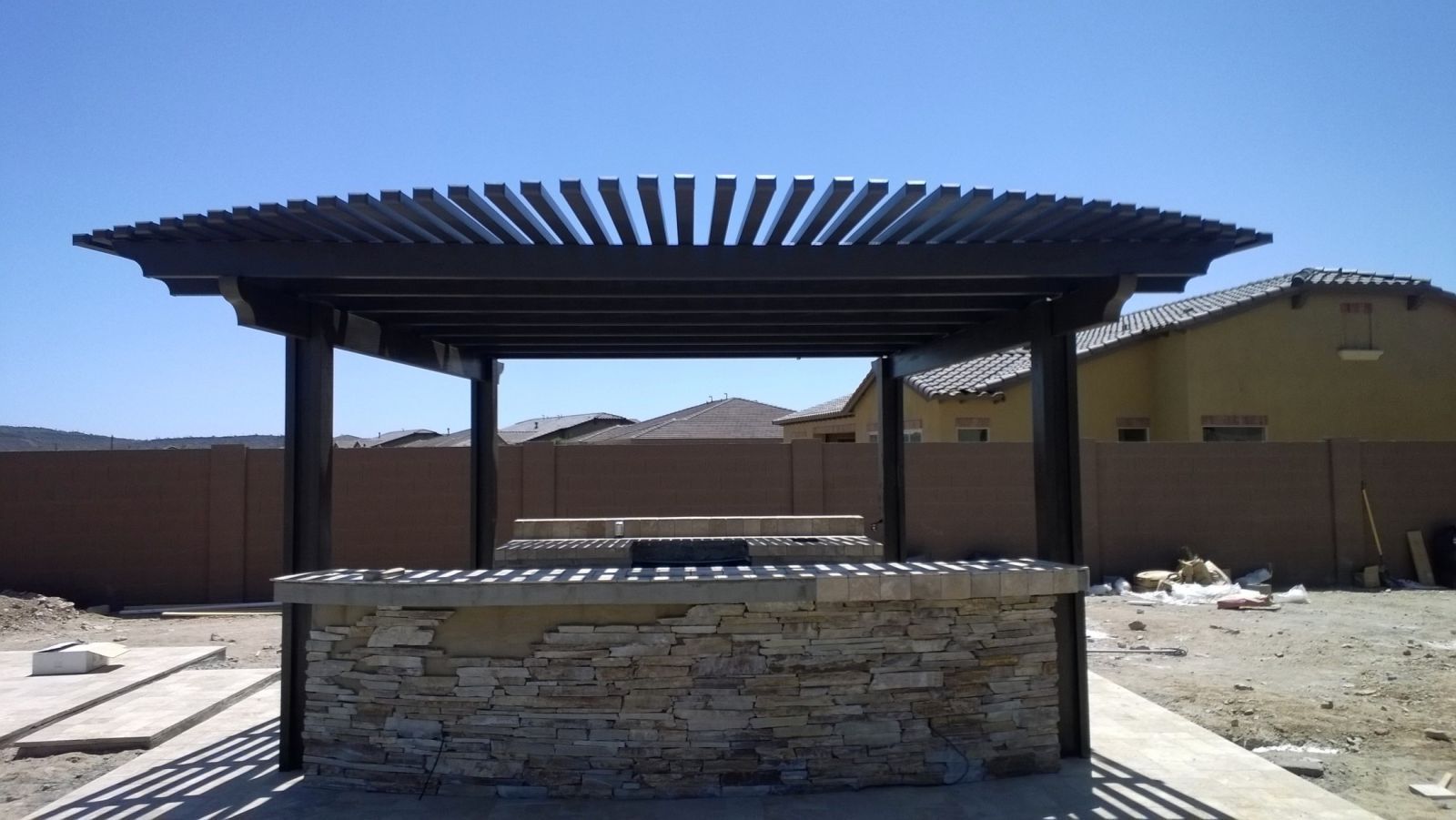 Beautiful Mesa home enhanced with a custom patio cover by Southwest Patio, blending seamlessly with Arizona's landscape.