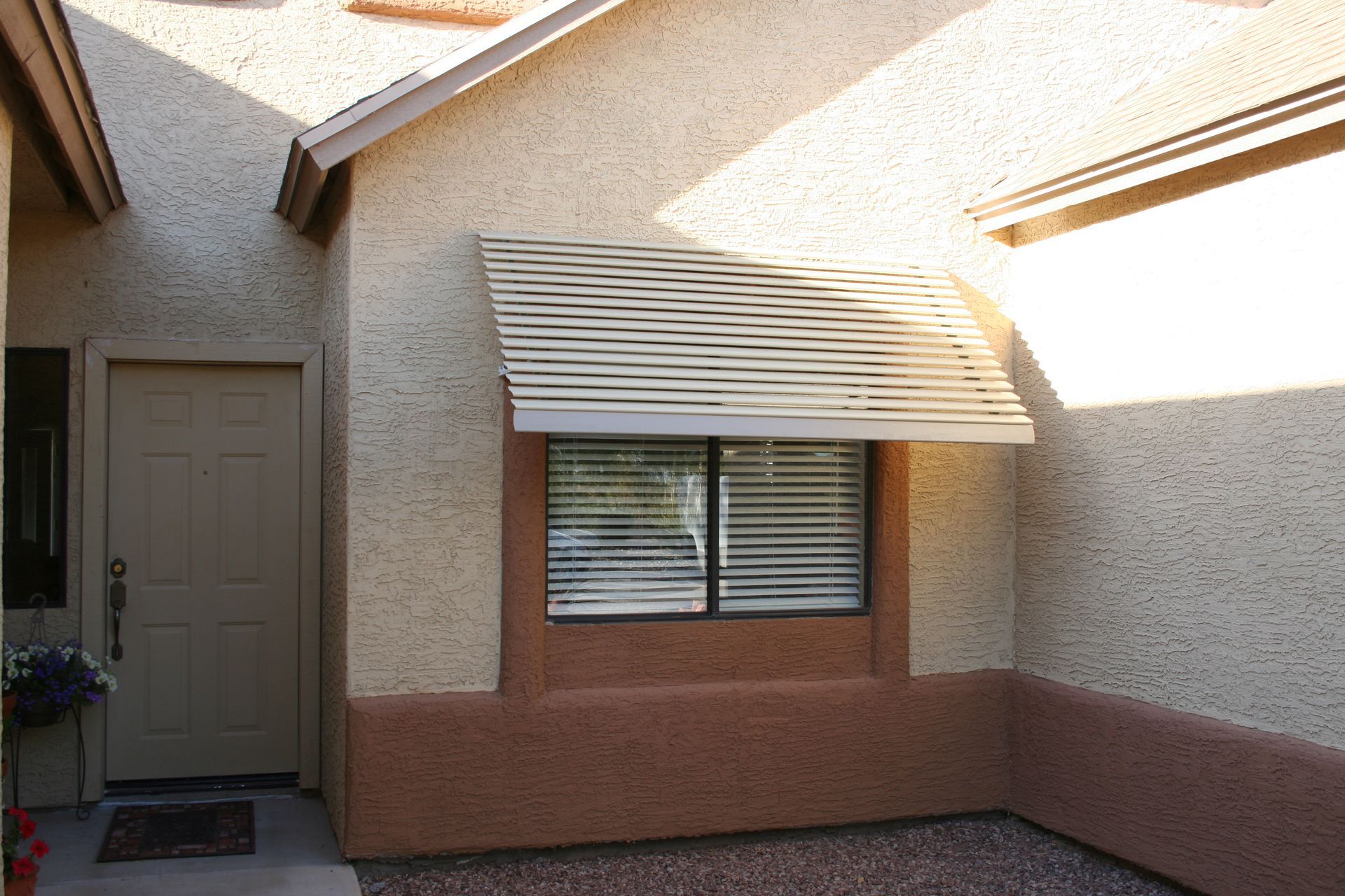 Beautiful Mesa home enhanced with a custom patio cover by Southwest Patio, blending seamlessly with Arizona's landscape.