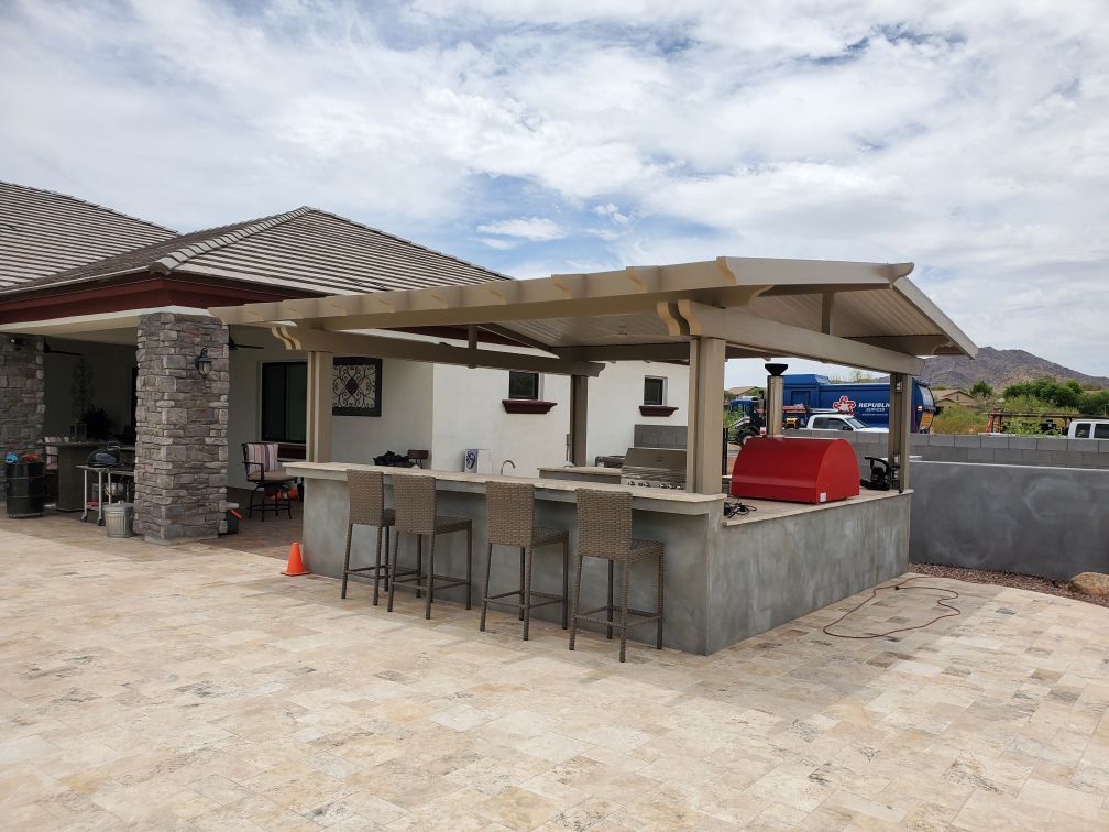 Sophisticated gabled patio cover, integrating seamlessly with a Peoria home's aesthetic.