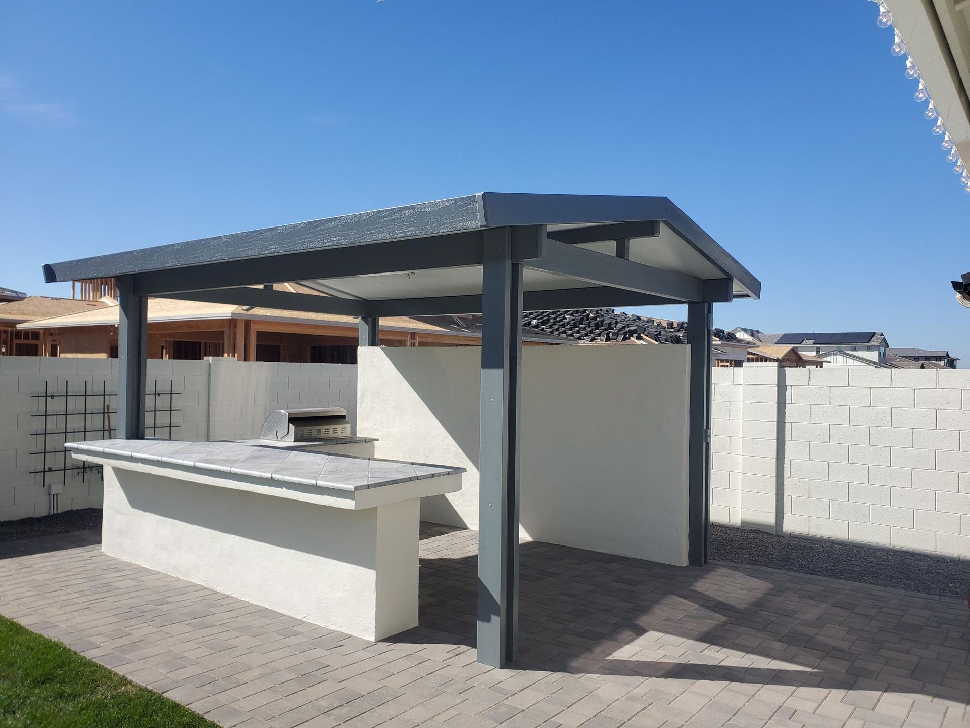 Chic gabled patio cover installation in New River, crafted by Southwest Patio for enhanced backyard luxury.