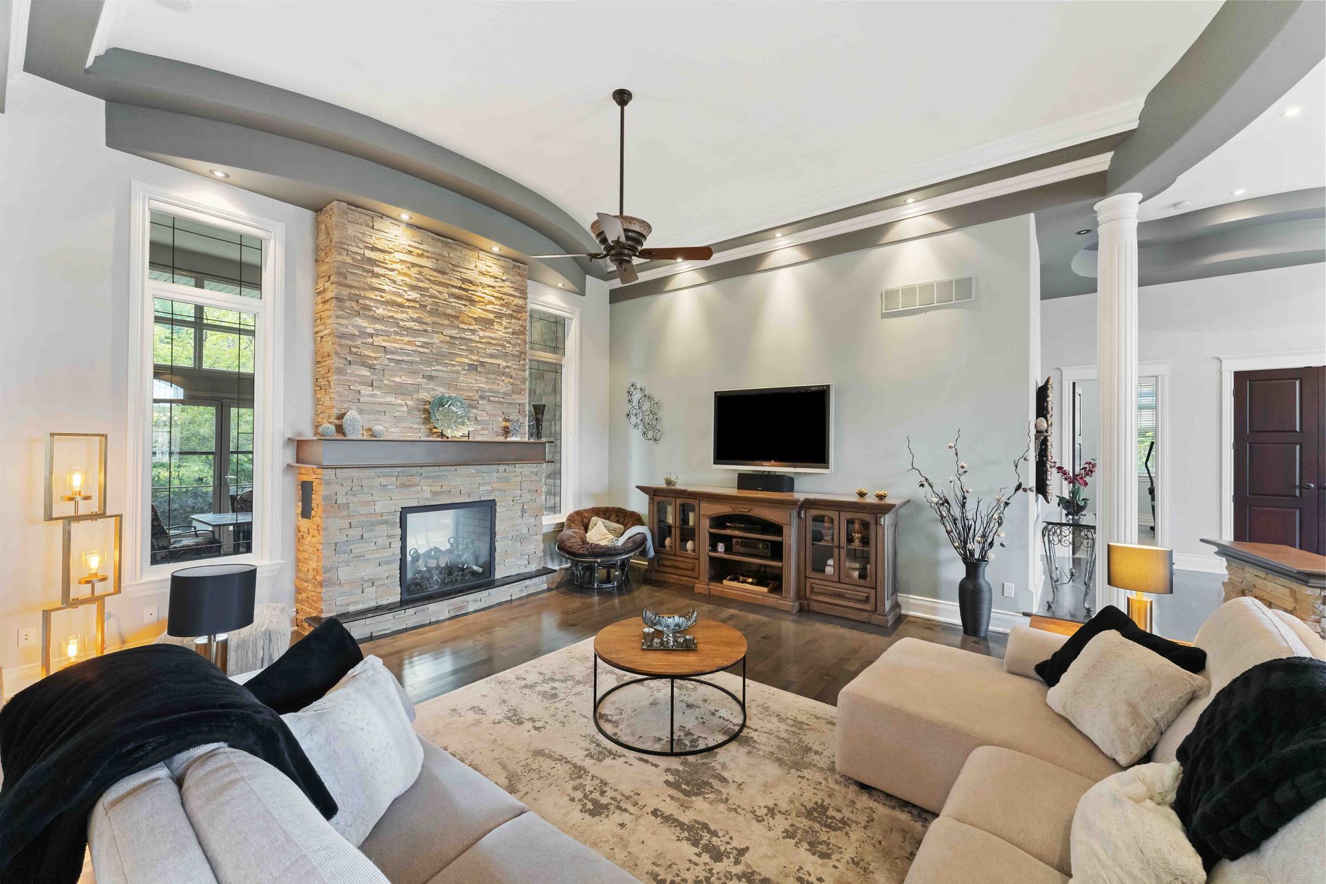 A living room filled with furniture and a fireplace.