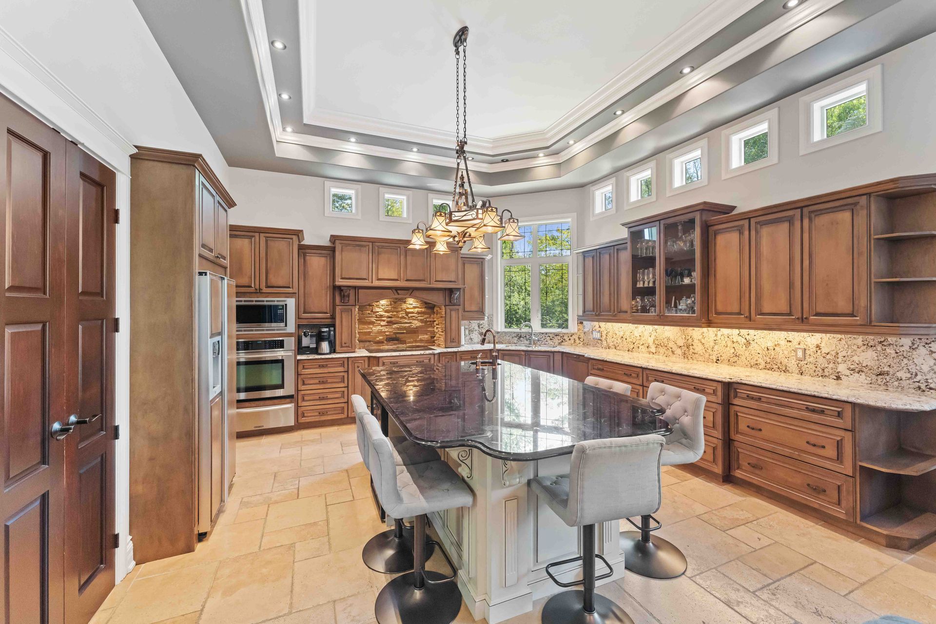 There is a large island in the middle of the kitchen.