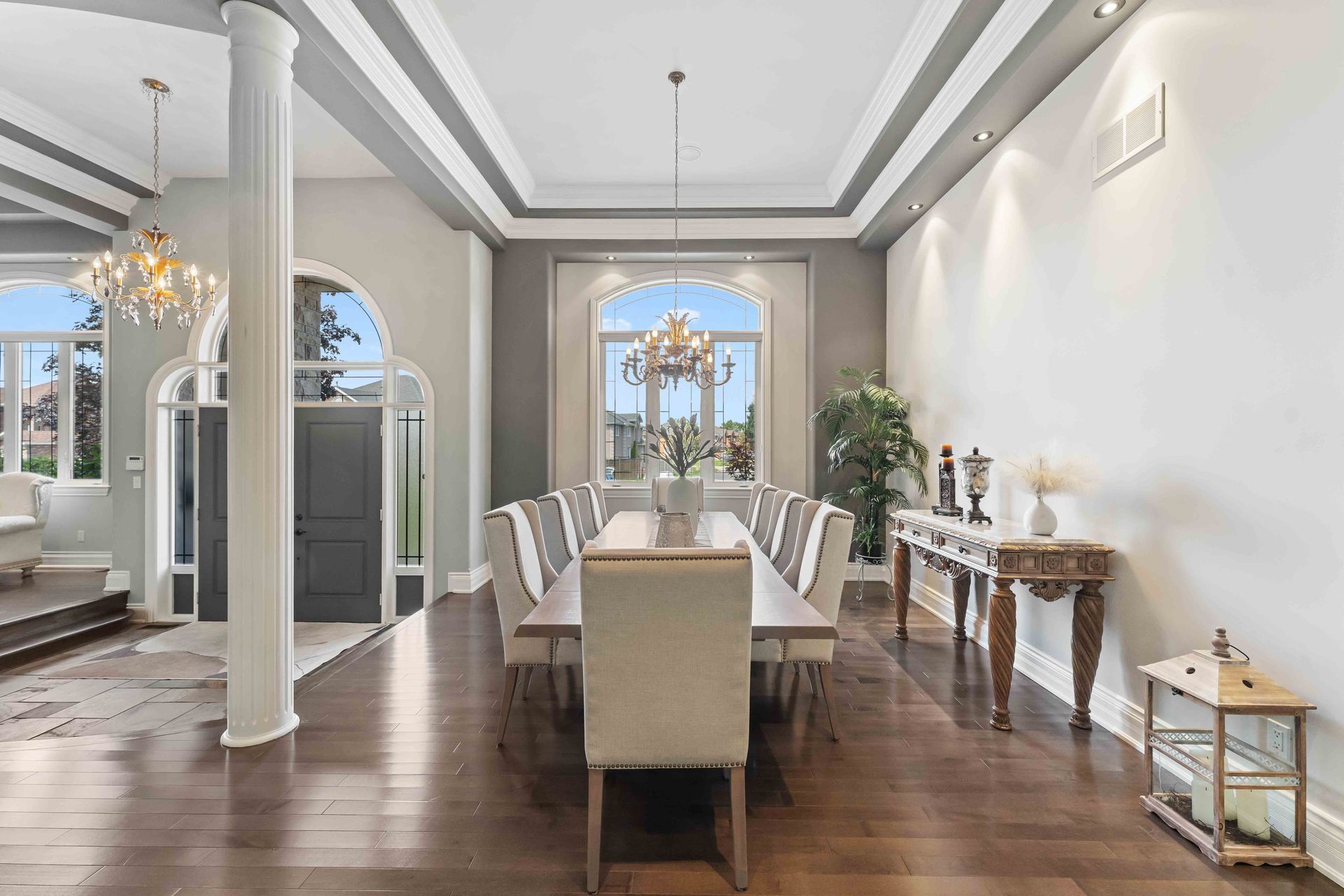 A large dining room with a long table and chairs