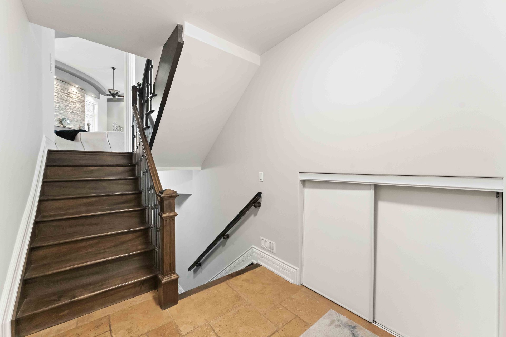 A wooden staircase leading up to the second floor of a house.