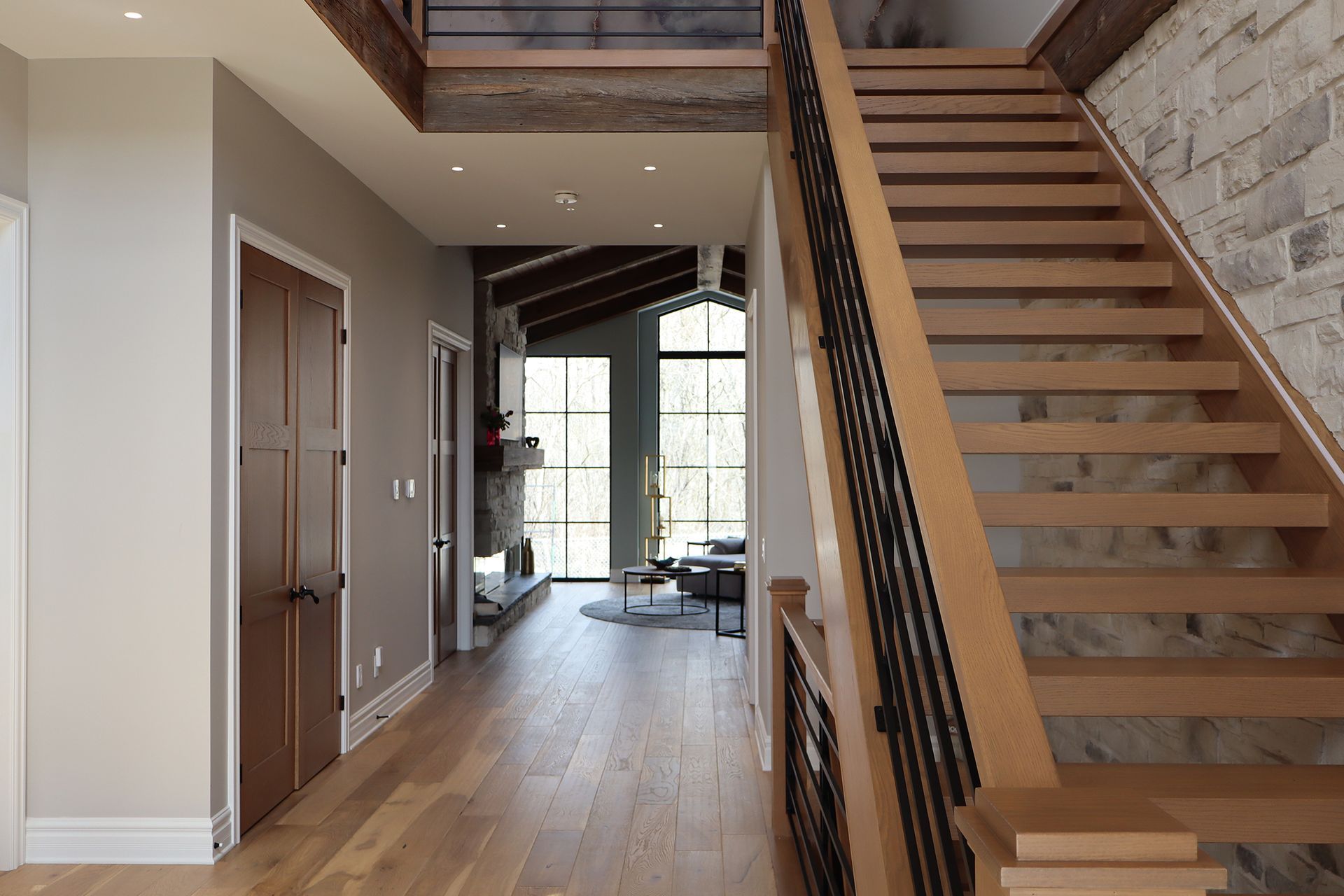 A wooden staircase leading up to the second floor of a house.