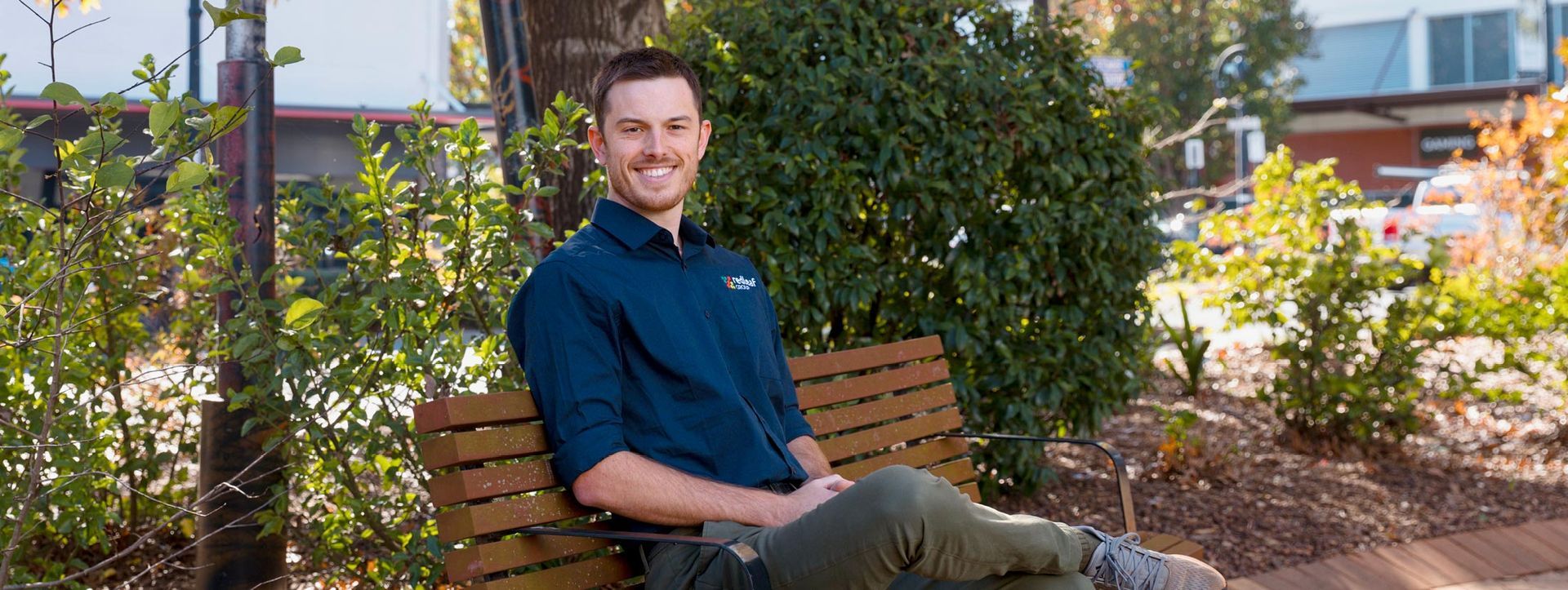Lachlan Harriman sitting on a bench