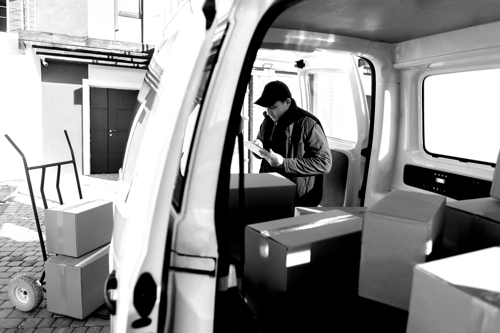 Breaking ocean wave, white foam against teal and dark blue water.