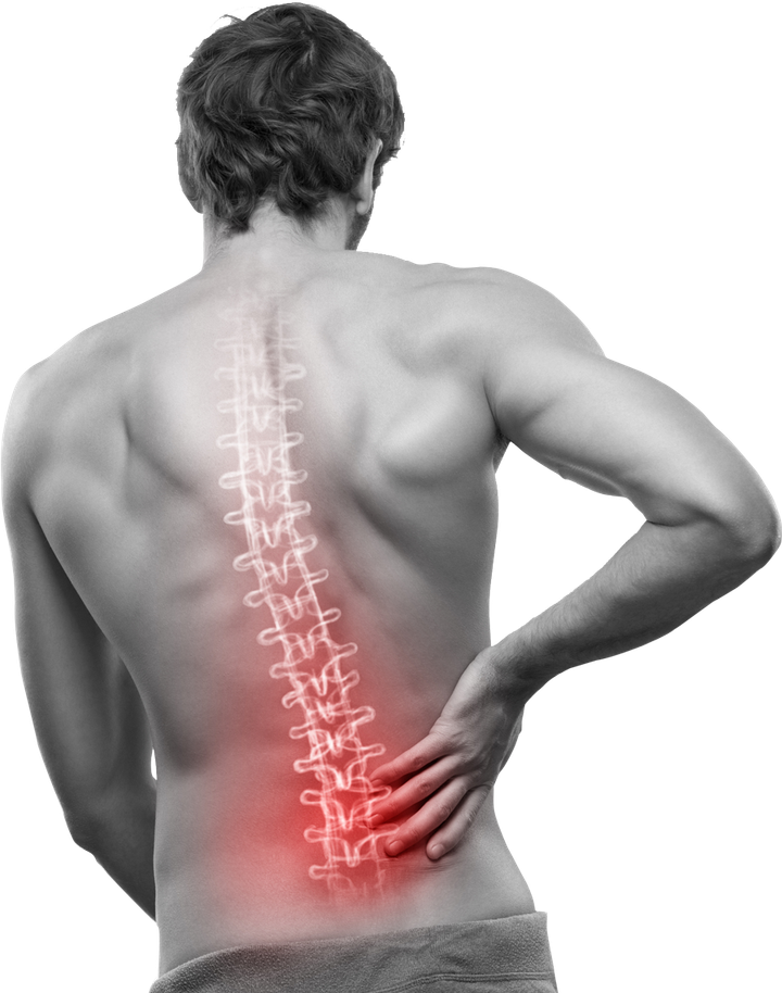 A man is holding his back in pain while a spine is shown in red.