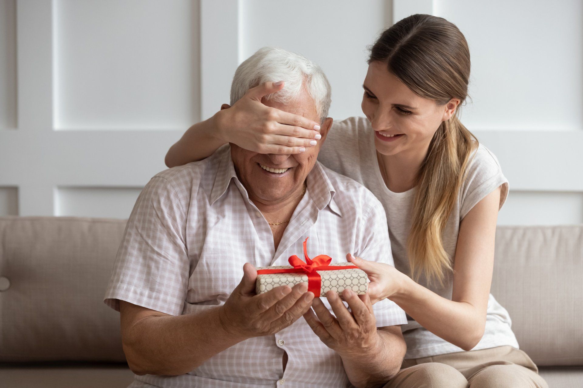 Caregiver Giving Old Man a Gift — Cypress, TX — C&J Caring Hearts Assisted Living LLC