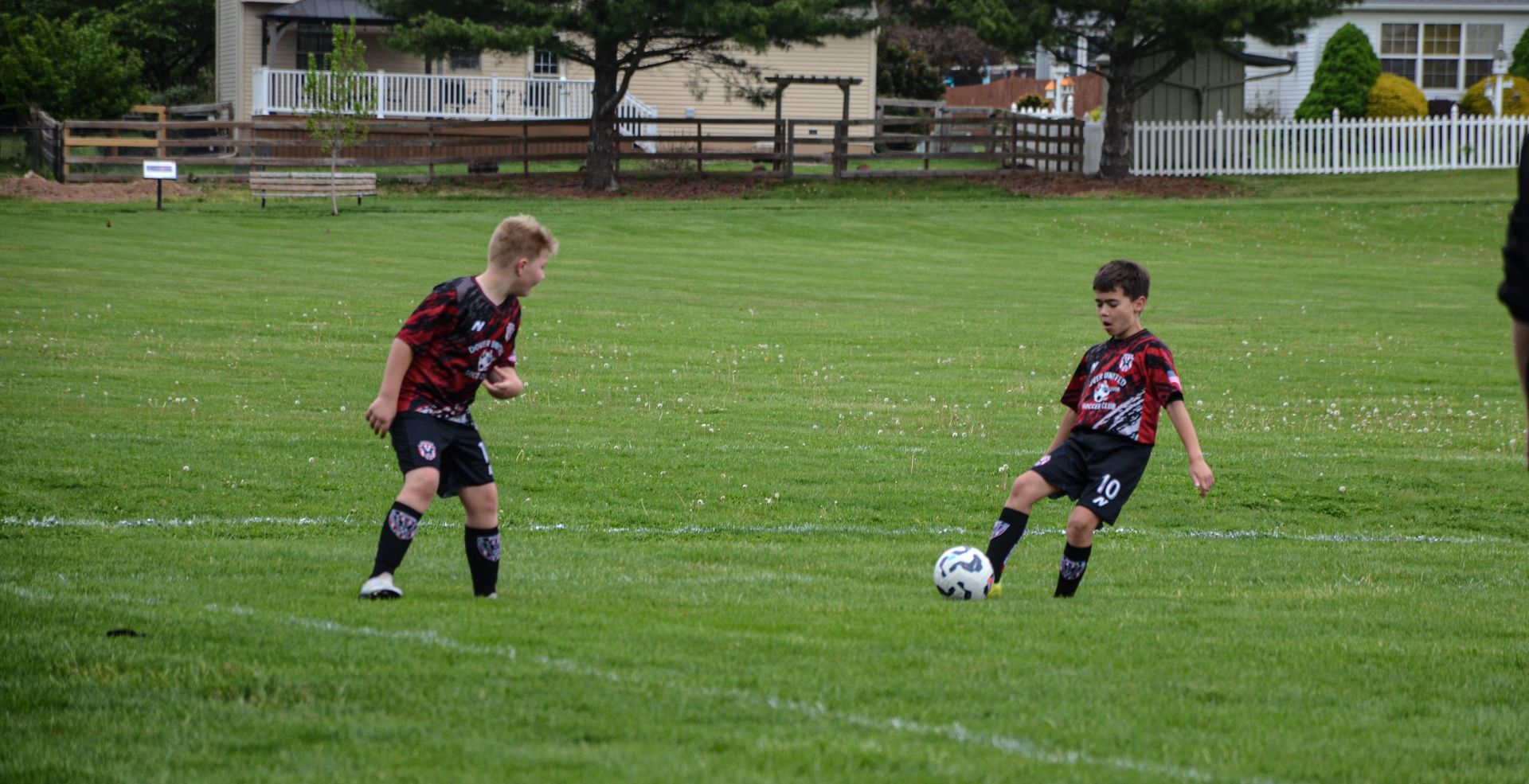 Youth soccer players competing on a sunny field in York, PA.