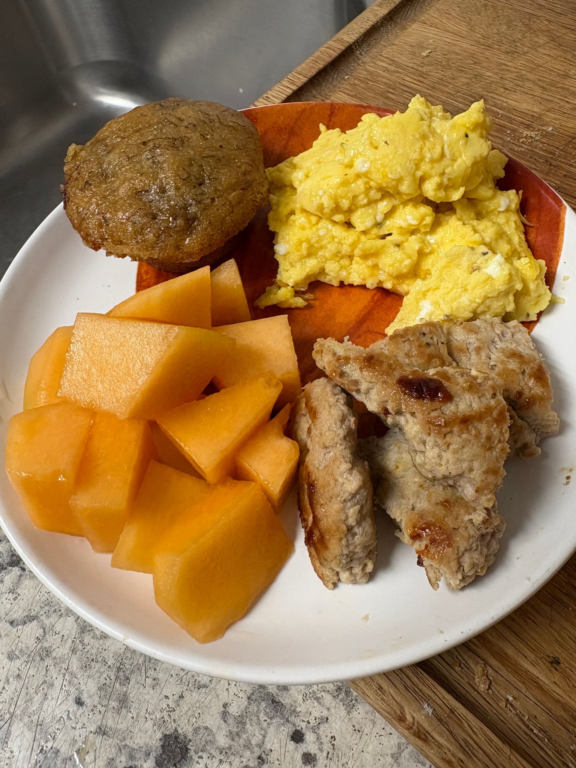 A white plate topped with meatballs