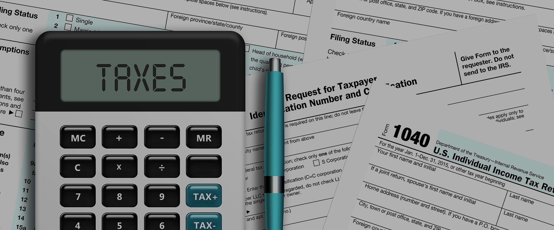 A calculator with the word taxes on it