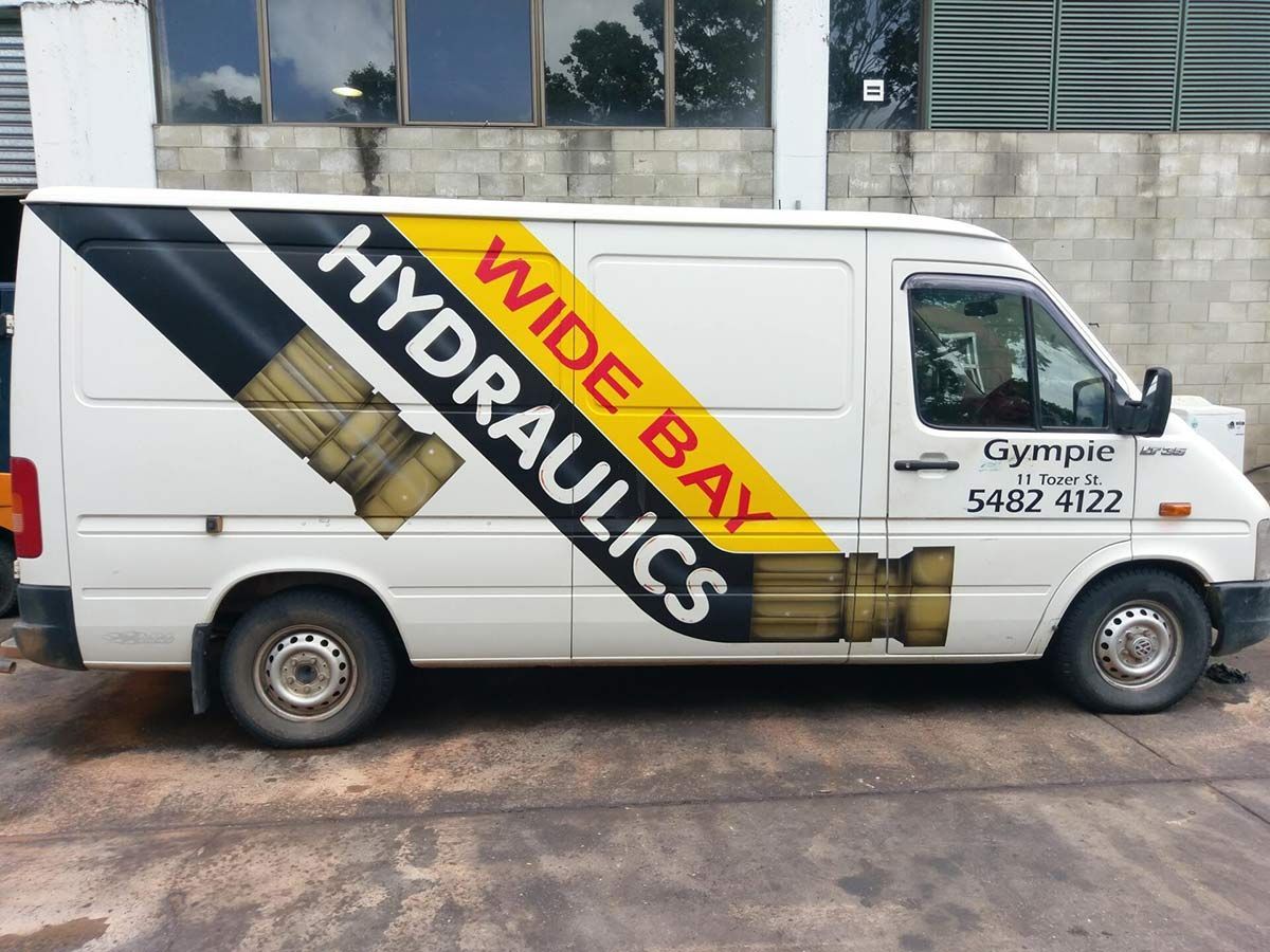 A White Van With Hydraulics Written On The Side — Wide Bay Hydraulics in Gympie, QLD