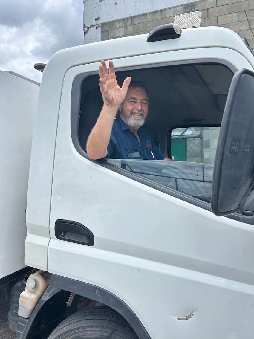 Man Waving From Truck — Wide Bay Hydraulics in Gympie, QLD