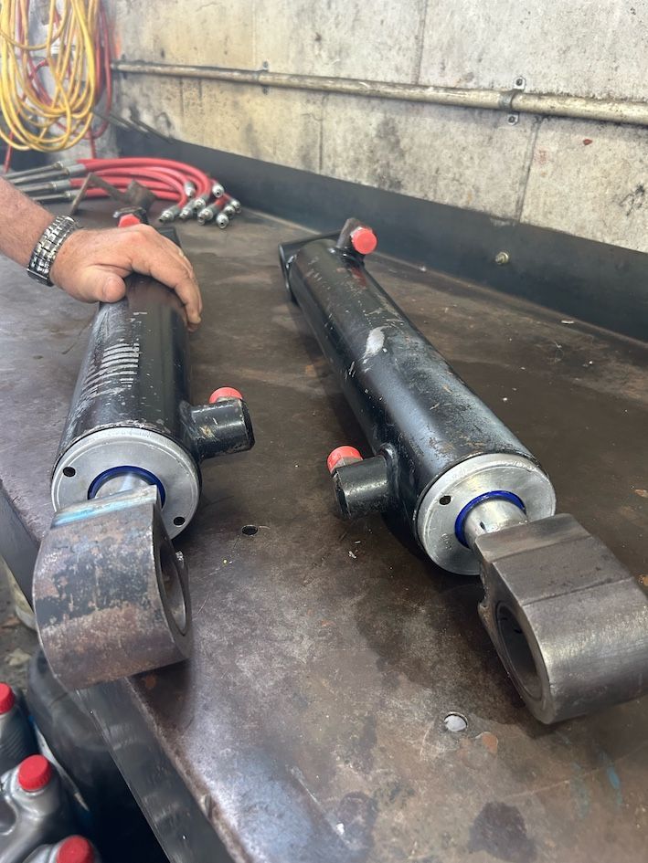 A Bunch Of Pipes And Wires Are Connected To A Machine — Wide Bay Hydraulics in Cooroy, QLD