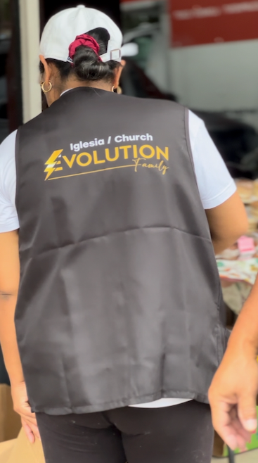 Person wearing a black vest with 