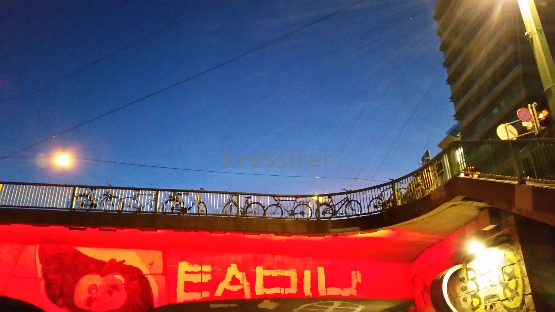 A red wall with the word eadila written on it