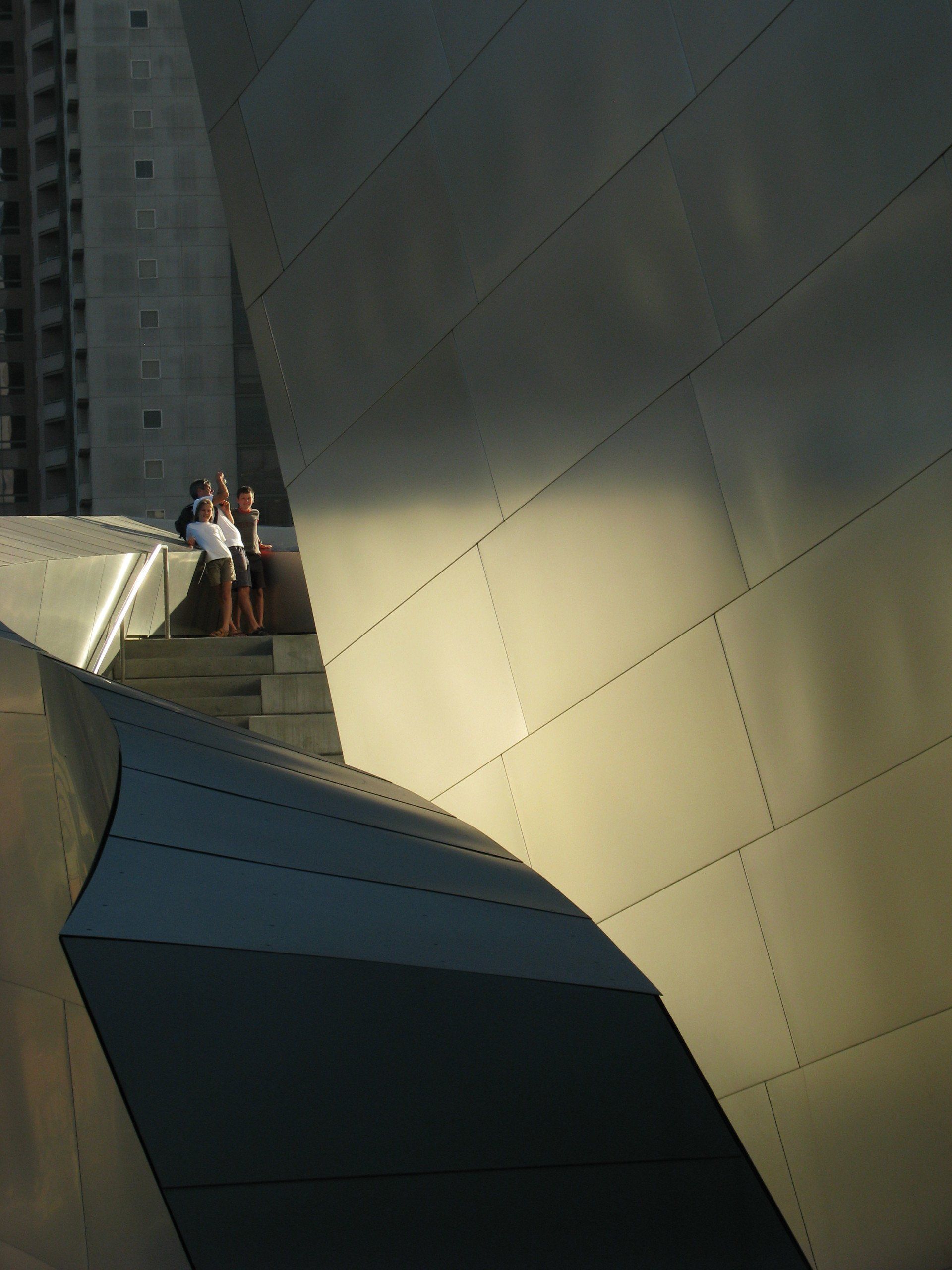 A couple of people standing on top of a building