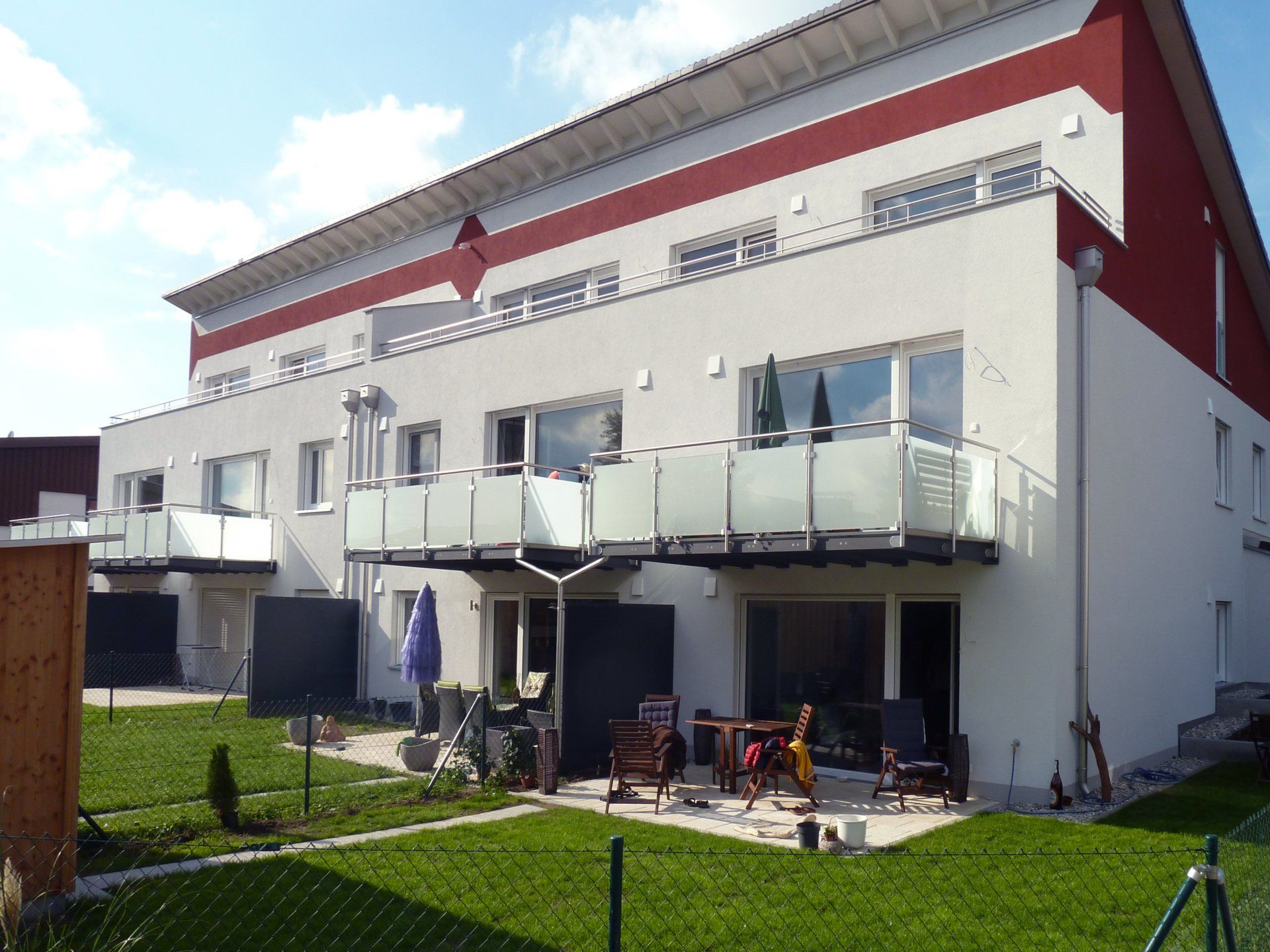 A house with a lot of windows and balconies