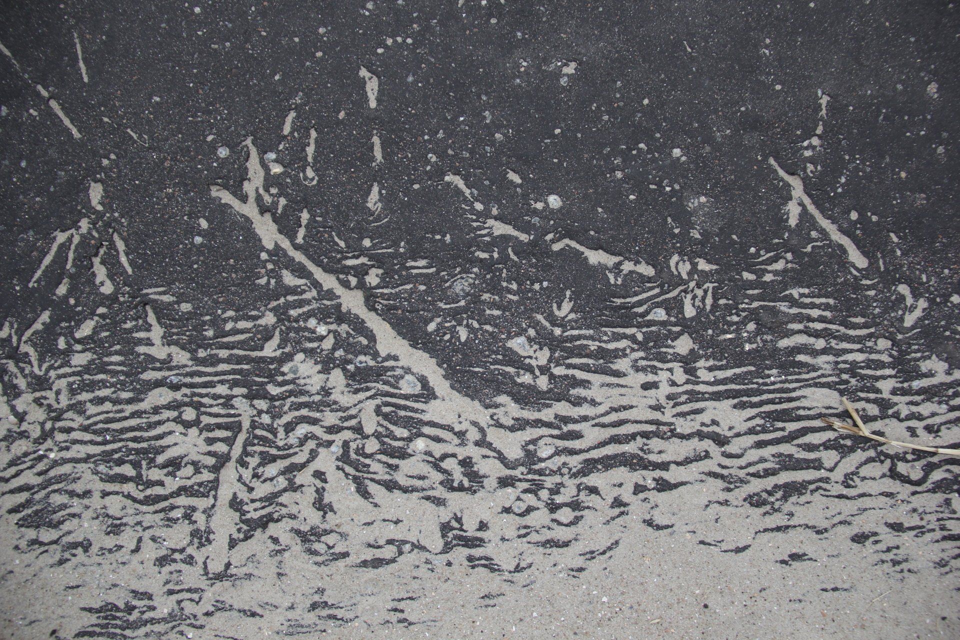 A black and white photo of a gray surface