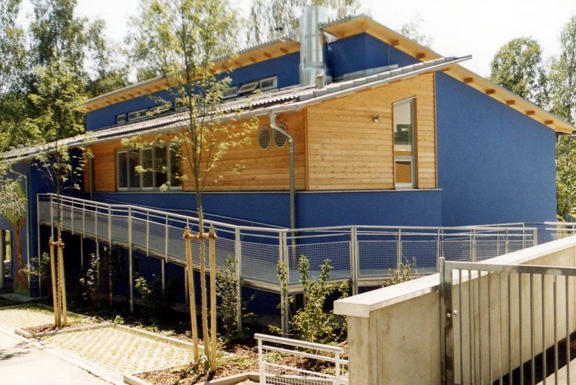 A blue building with a ramp leading to it