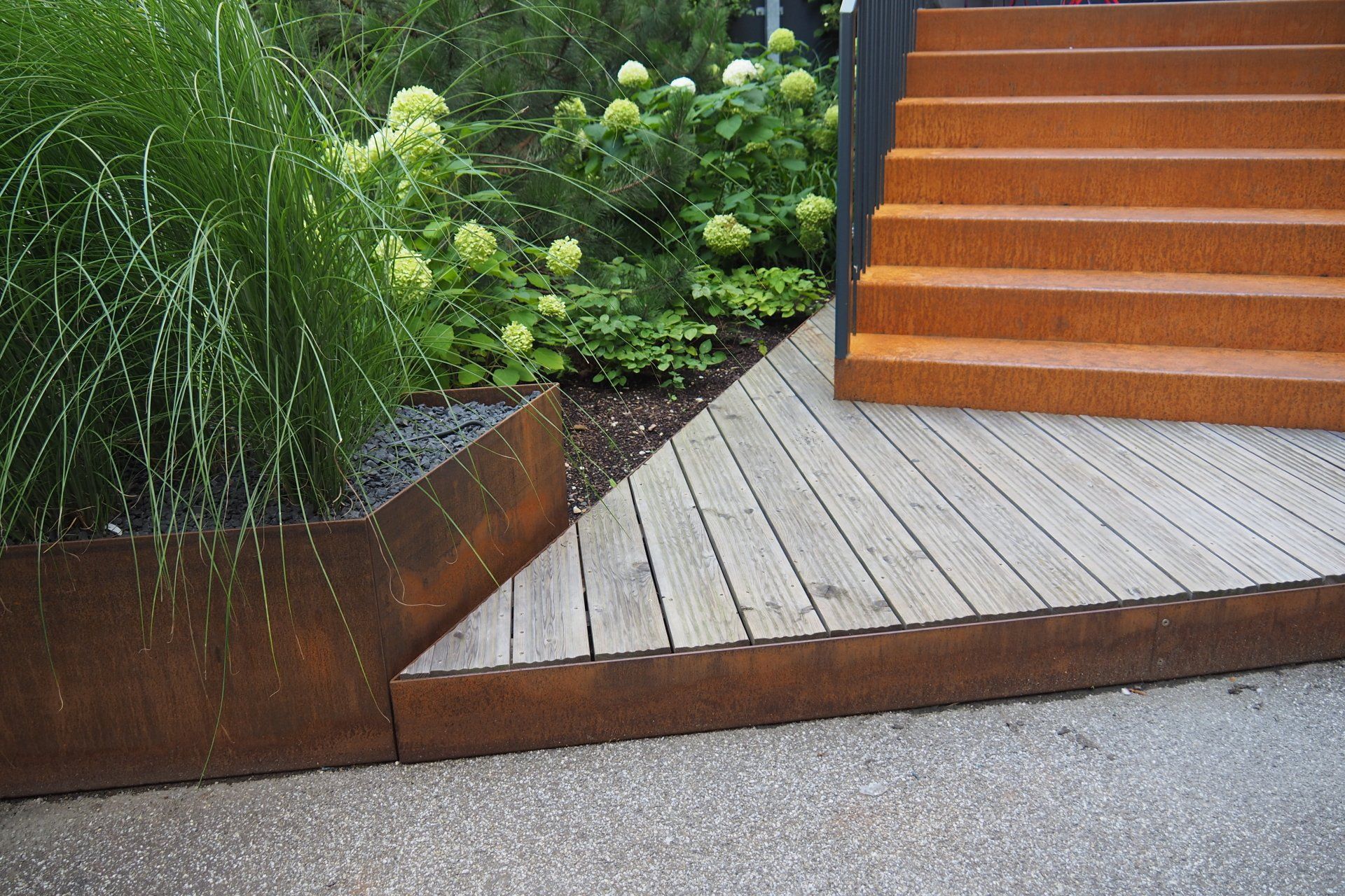 A wooden deck with stairs leading up to it