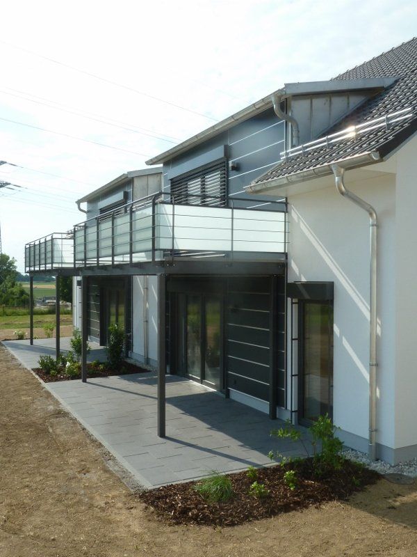 A house with a balcony on the side of it
