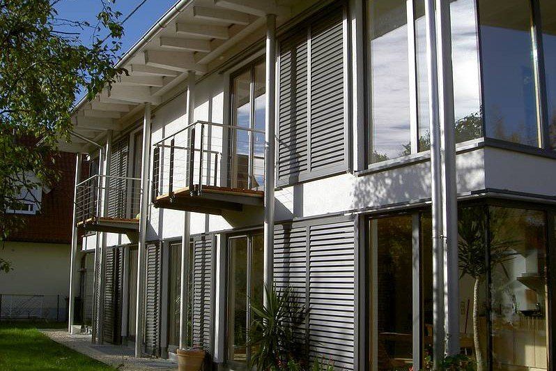 A large house with lots of windows and a balcony