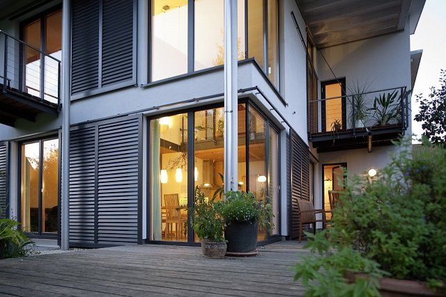 A large house with a lot of windows and a balcony
