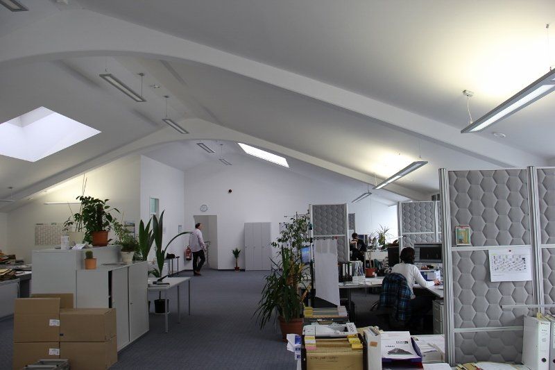 A large office with a skylight on the ceiling