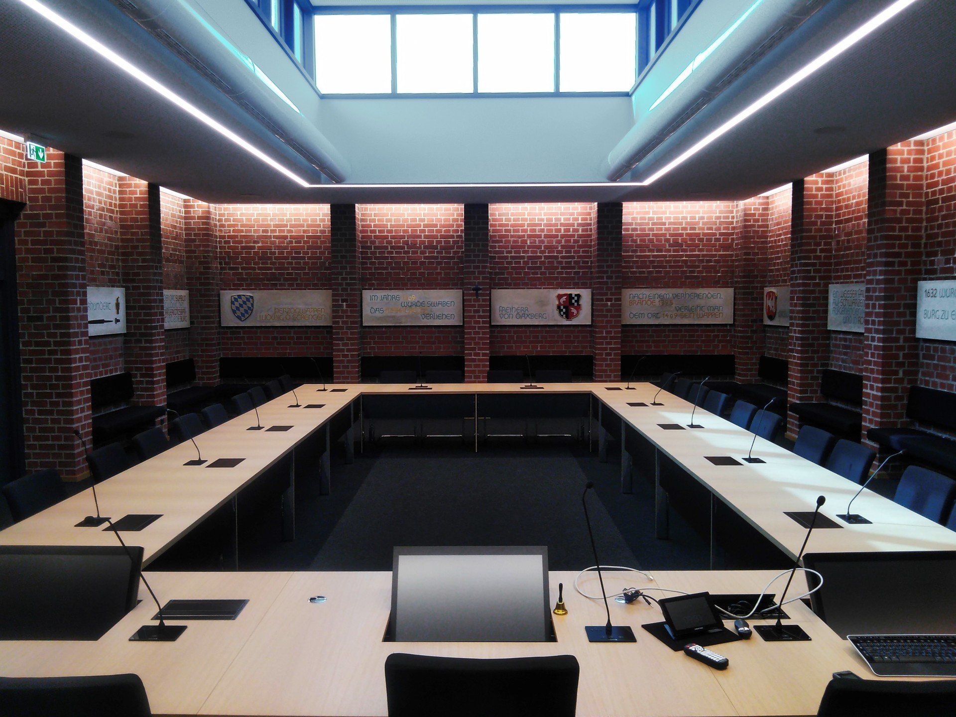 A conference room with a long table and chairs