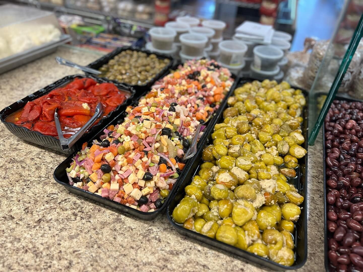 There are many different types of food on the counter.