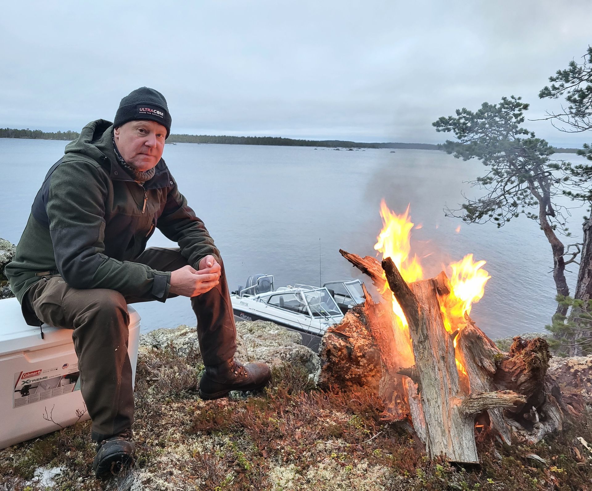 Autentic Boreal CEO pekka leaning against a tree wearing hunting gear