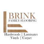 Logo for Brink Family Flooring: Text with a wooden plank design; listing hardwoods, laminates, vinyls, and carpet.