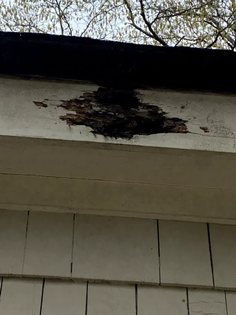 A close up of a roof with a hole in it