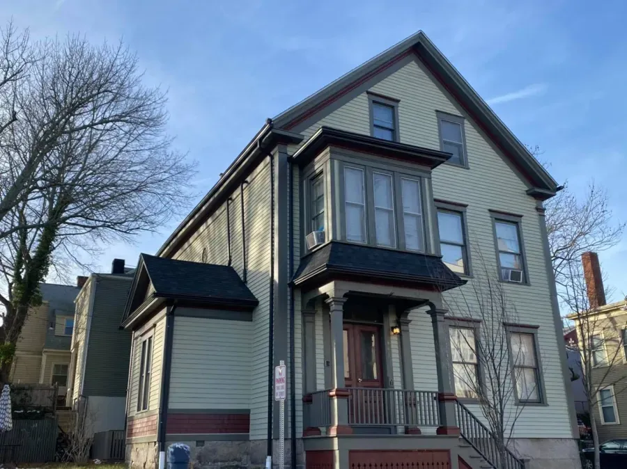 A large house with a lot of windows and stairs