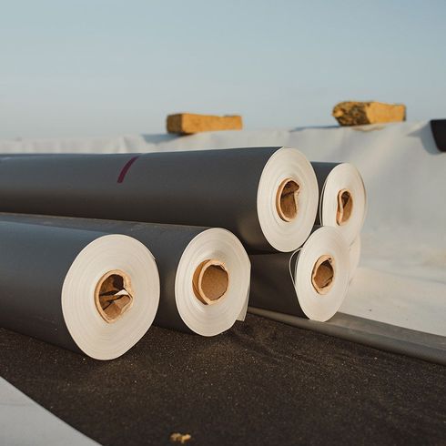 Several rolls of paper are stacked on top of each other